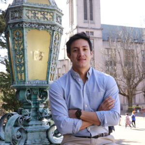 Ruben Salazar-Izquierdo sitting in front of Suzzalo Library